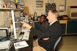 Dr. Swier and student evaluating experiment results